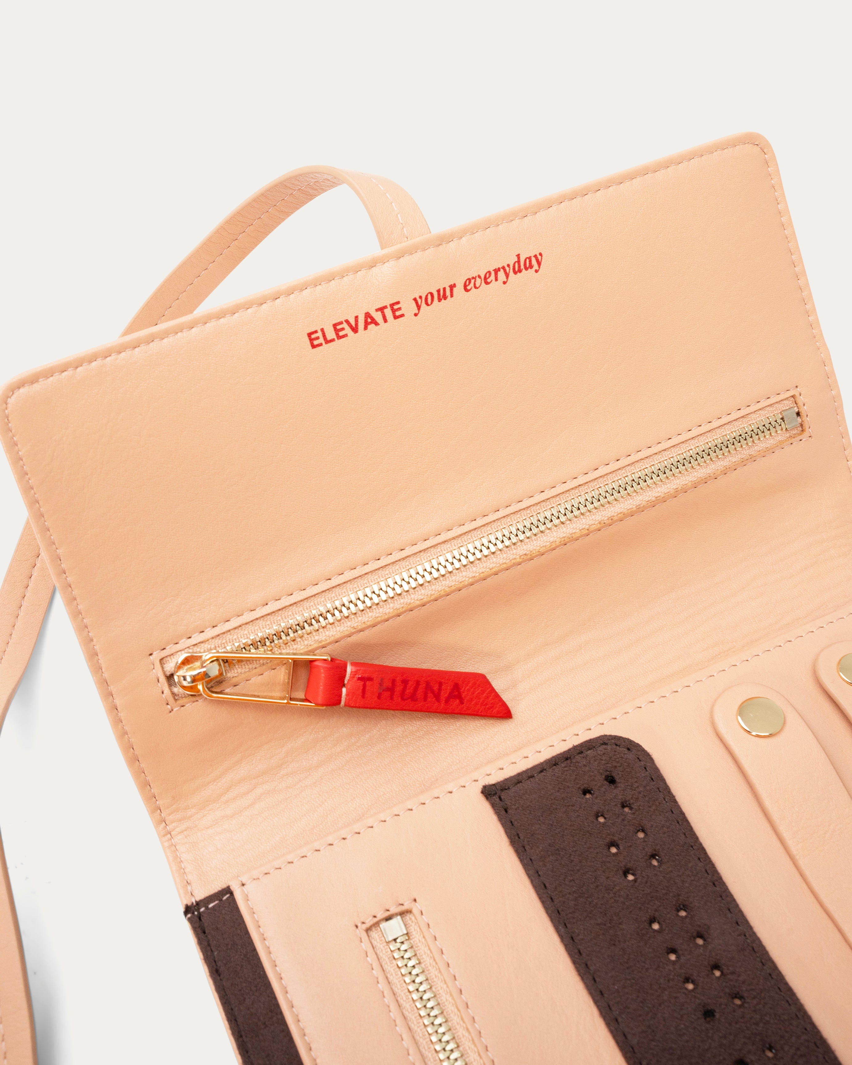 Two-tone beige and brown clutch bag on a light gray background - Kuwait bags